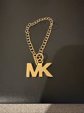 Michael Kors Gold Tone MK Logo Bracelet